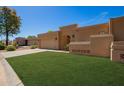 Beautiful single-story house with a well-maintained lawn and a two-car garage at 6313 E Aire Libre Ln, Scottsdale, AZ 85254