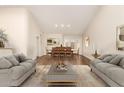 Bright living room with hardwood floors, neutral paint, soaring ceilings and ample seating for entertaining at 6313 E Aire Libre Ln, Scottsdale, AZ 85254