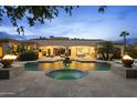 Outdoor oasis featuring a pool, spa, fountain, and covered patio with ample seating at 6852 E Fanfol Dr, Paradise Valley, AZ 85253