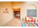 Welcoming front entrance with tiled patio, colorful bench, and decorative welcome sign at 873 W Sterling Pl, Chandler, AZ 85225