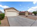 A single-Gathering home with a well-maintained yard and an attached two-car garage at 900 E Saratoga St, Gilbert, AZ 85296