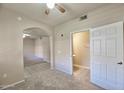 Cozy bedroom boasts neutral tones, ceiling fan, and convenient access to an ensuite bathroom at 920 E Devonshire Ave # 4021, Phoenix, AZ 85014