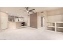 Bright living room showing the open floor plan, built-in shelving, and adjacent dining area at 9750 N Monterey Dr # 21, Fountain Hills, AZ 85268