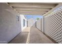 Backyard featuring an exterior building, concrete flooring, and decorative lattice at 1422 E Windsor Ave, Phoenix, AZ 85006