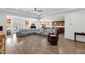 Expansive open-concept living room featuring hardwood floors and recessed lighting at 15360 W Corrine Dr, Surprise, AZ 85379