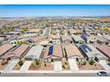 Expansive aerial view of a residential neighborhood featuring many single-story homes at 12474 W Glenn Ct, Glendale, AZ 85307