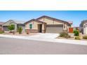 Charming single-story home featuring a two-car garage and low-maintenance desert landscaping at 12474 W Glenn Ct, Glendale, AZ 85307