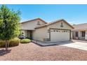 Charming single-story home with a well-maintained front yard and a two-car garage at 3269 E San Remo Ave, Gilbert, AZ 85234