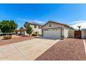 View of two homes showcasing driveways and attached two-car garages at 3269 E San Remo Ave, Gilbert, AZ 85234