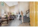 Inviting living room with high ceilings, plush sofas, and a staircase, perfect for comfortable living and entertaining at 6409 N 11Th Dr, Phoenix, AZ 85013