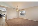 Open-concept dining room featuring large windows and neutral colored walls at 1024 N Ithica Ct, Chandler, AZ 85225
