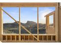 The structure frames picturesque mountain views creating an inviting indoor-outdoor living experience at 10716 N Skyline Dr, Fountain Hills, AZ 85268