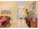 Bright entryway with tile flooring, art, and an inviting decor at 10861 E Olla Ave, Mesa, AZ 85212