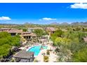 Beautiful pool area with lounge chairs, pergola, and mountain views at 20750 N 87Th St # 2038, Scottsdale, AZ 85255
