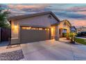 Well-maintained single-story home with a spacious driveway and covered front porch at 3379 E San Pedro Ave, Gilbert, AZ 85234