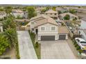 Aerial view of a two-story home with desert landscaping, extended drive, and large backyard at 40161 N Westray Way, San Tan Valley, AZ 85140