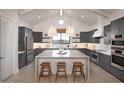 Modern kitchen with sleek gray cabinets, stainless steel appliances, and a large center island at 42046 N Golden Trl, San Tan Valley, AZ 85140