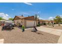 Exterior of a single story home with low maintenance desert landscaping at 5537 W Boca Raton Rd, Glendale, AZ 85306