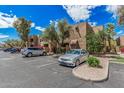 Apartment building exterior showcasing well-maintained grounds, landscaping, and convenient parking at 5877 N Granite Reef Rd # 2240, Scottsdale, AZ 85250