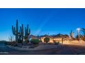 Exterior features include desert landscaping, Southwestern architecture, and a covered drive at 612 N Signal Butte Rd, Mesa, AZ 85207