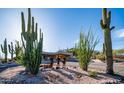 Exterior features desert landscaping, Southwestern architecture, and exterior art at 612 N Signal Butte Rd, Mesa, AZ 85207