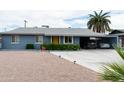Charming single-story home with a well-manicured yard and a convenient carport at 615 E Mckellips Rd, Tempe, AZ 85288