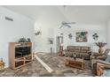 Inviting living room with tiled floors, a ceiling fan, and plenty of natural light at 6331 S Cypress Point Dr, Chandler, AZ 85249