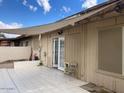 Covered back patio featuring tile flooring and a partial shade covering at 849 W Duke Dr, Tempe, AZ 85283