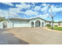 This inviting single-story home features a well-kept front yard, driveway and a basketball hoop at 10016 N 39Th Dr, Phoenix, AZ 85051