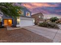 Charming two-story home featuring a large two car garage, beautiful blue siding, and a lovely tiled roof at 10831 E Azalea Ave, Mesa, AZ 85208