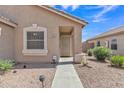 Exterior image of a house entrance with a security door and landscaped yard at 12605 W Dreyfus Dr, El Mirage, AZ 85335