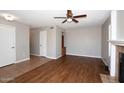 Spacious living room with hardwood floors, neutral paint, recessed lights, and fireplace at 2040 S Longmore St # 7, Mesa, AZ 85202
