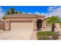 Attractive house with a two-car garage, desert landscaping, and a stone facade at 20740 N 62Nd Ave, Glendale, AZ 85308