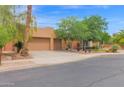 Inviting one-story home with a two-car garage and xeriscaped front yard for low-maintenance living at 2246 E Crescent Pl, Chandler, AZ 85249