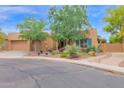Charming single-story home featuring desert landscaping, a two-car garage, and a welcoming front entrance at 2246 E Crescent Pl, Chandler, AZ 85249