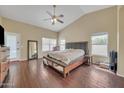 Spacious main bedroom with high ceilings, wood floors, and a comfortable king-sized bed at 2343 E Kempton Rd, Chandler, AZ 85225