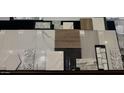 An assortment of floor and wall tile samples showcases numerous texture, color, and style options at 24422 N 128Th Way, Scottsdale, AZ 85255