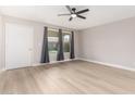Light and airy bedroom with ceiling fan and plank flooring at 2502 N 22Nd Dr, Phoenix, AZ 85009