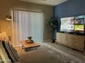Cozy living room with a comfortable couch, stylish decor, and a large window with natural light at 2511 W Queen Creek Rd # 244, Chandler, AZ 85248