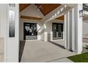 Spacious covered patio boasting stylish lighting and gray stone accents at 26631 S 169Th Pl, Queen Creek, AZ 85142