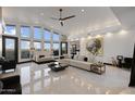 Bright, expansive living room with vaulted ceilings, sleek flooring, and views of the city at 27 W Cochise Dr, Phoenix, AZ 85021