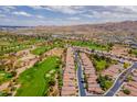 Stunning aerial view of a golf course community with mountain views and lush landscaping at 3252 E Maldonado Dr, Phoenix, AZ 85042