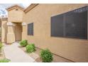 A cozy home featuring a decorative entrance, landscaped yard, and a classic tile roof at 3252 E Maldonado Dr, Phoenix, AZ 85042