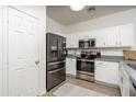 Modern kitchen featuring stainless steel appliances and white cabinets at 7028 W Lincoln St, Peoria, AZ 85345