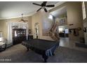 Spacious living room with stairs, decorative furnishings, and high ceilings with ceiling fans at 7240 W Los Gatos Dr, Glendale, AZ 85310