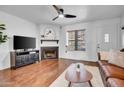 Living room with fireplace, flatscreen television, and comfortable seating at 7977 W Wacker Rd # 134, Peoria, AZ 85381