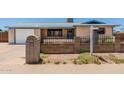 Single story brick home with a well manicured front yard and inviting curb appeal at 900 S Palo Verde Dr, Apache Junction, AZ 85120