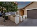 Single-Gathering home with well-kept front yard and desert landscaping with a quaint front porch at 20848 E Desert Hills Blvd, Queen Creek, AZ 85142