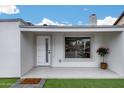 Inviting front entrance with a modern door, picture window, and potted flowers for curb appeal at 2236 N 22Nd St, Phoenix, AZ 85006