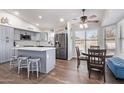 Beautiful kitchen with stainless steel appliances, quartz countertop, eat in kitchen table, and lots of natural light at 343 S Cottonwood St, Chandler, AZ 85225